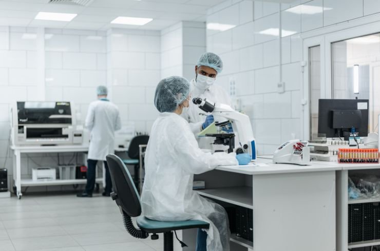 Medical laboratory technicians conducting diagnostic tests in a Asra hospital lab